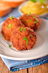 Image showing meat balls with mustard on white dish 