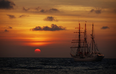 Image showing Old sailing ship in the sea at sunset