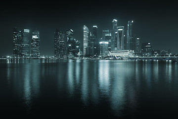 Image showing Singapore skyline at night - skyscrapers with reflections.