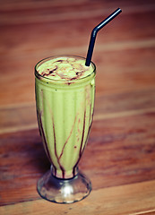 Image showing Fruit shake in a glass on the table -  exotic drink.