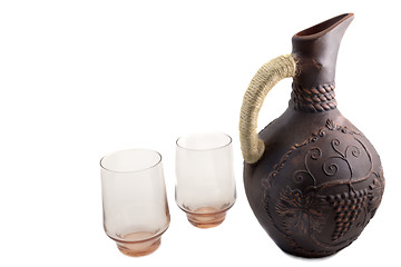 Image showing Ceramic jug for wine from red clay on a white background