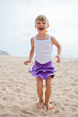 Image showing Young girl playing on beach