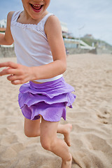 Image showing Young girl playing on beach