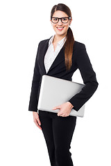 Image showing Confident female manager holding laptop