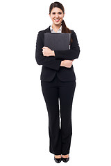 Image showing Pretty female secretary holding business files