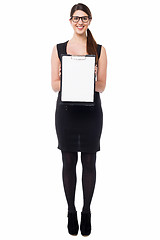 Image showing Business executive displaying blank clipboard