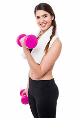 Image showing Young girl lifting dumbbells, biceps exercise