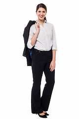 Image showing Corporate lady with blazer slung over her shoulder