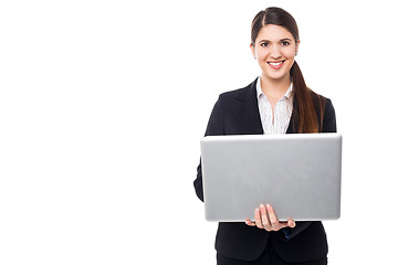 Image showing Attractive woman in formals working on laptop