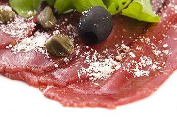 Image showing Beef carpaccio with rucola and parmesan 