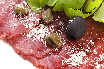 Image showing Beef carpaccio with rucola and parmesan 