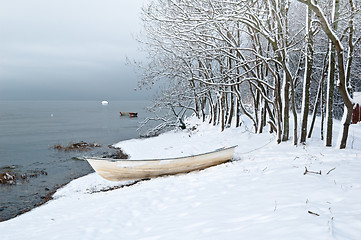 Image showing Winter landscape with a fishing boat on seacoast
