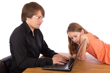 Image showing Daughter looks at her father's laptop