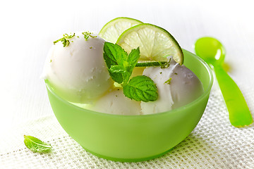 Image showing bowl of fresh lime sorbet decorated with lime and mint