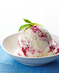 Image showing ice cream portion decorated with green mint leaf