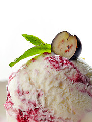 Image showing closeup of blueberry ice cream decorated with mint and berry