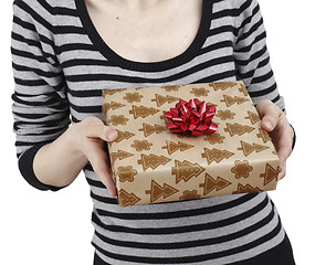 Image showing Young woman holding a present