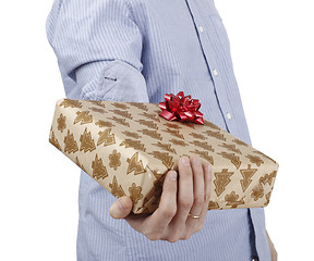 Image showing Young man holding a present