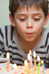 Image showing Cute boy at birthday cake