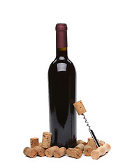 Image showing A bottle of wine, corks and corkscrew.