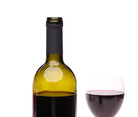 Image showing A bottle of red wine with a wine glass.