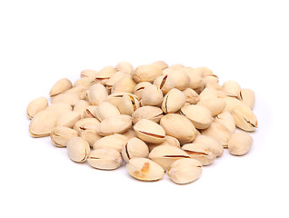 Image showing pistachios heap on the white background