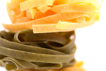 Image showing Tagliatelle paglia e fieno homemade tipycal italian pasta close-up.