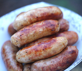 Image showing Pork sausages barbecued on the plate