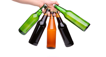 Image showing Five beer bottle hand