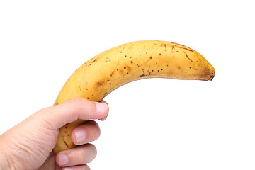 Image showing A stale banana in a hand