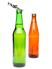 Image showing Two bottles of beer and a opener