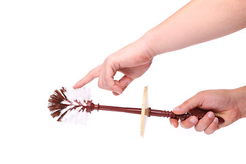 Image showing Brown toilet brush isolated in hand.