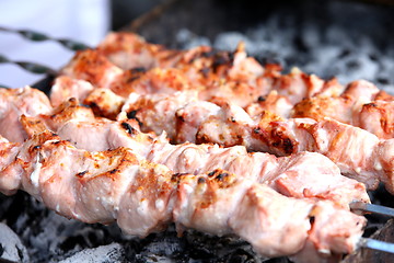 Image showing  Five beef skewers cooked on the barbecue