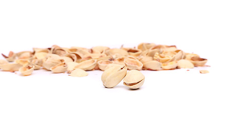 Image showing Two pistachios and peel.