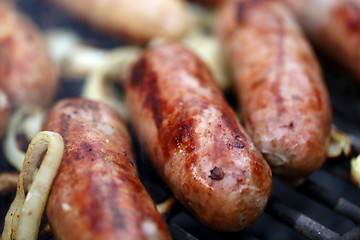 Image showing grilled sausages close up, barbecue