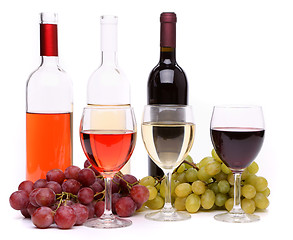 Image showing Ripe grapes, wine glasses and bottles of wine