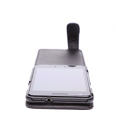 Image showing Mobile phone in its case over white background