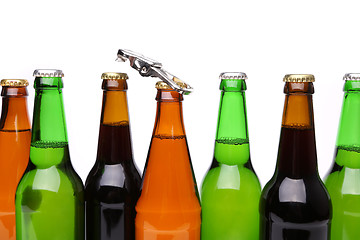 Image showing Different bottlenecks with a bottle opener