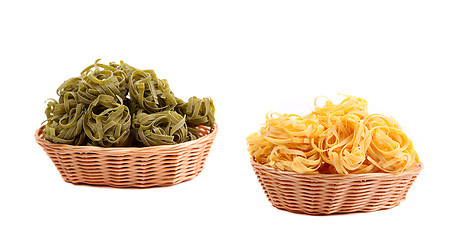 Image showing Tagliatelle paglia e fieno at round woven straw baskets.