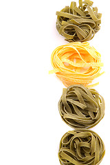 Image showing Tagliatelle paglia e fieno homemade tipycal italian pasta close-up.