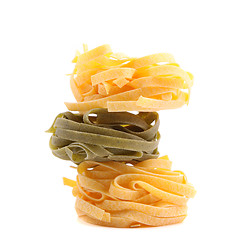 Image showing Tagliatelle paglia e fieno homemade tipycal italian pasta close-up.