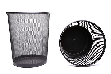 Image showing A metal trash can and a top plastic trash can