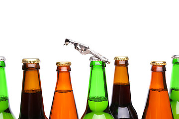 Image showing Top bottles of beer and a opener