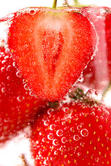 Image showing Strawberries with bubbles in water