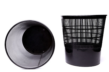 Image showing A plastic trash can and a top metal trash can