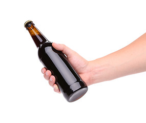 Image showing A bottle of beer in a hand