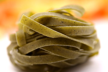 Image showing Tagliatelle paglia e fieno homemade tipycal italian pasta close-up.