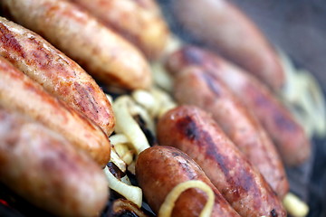 Image showing Bratwurst sausages on grill.