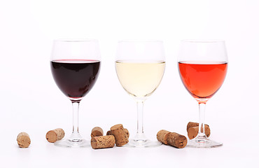 Image showing Three wine glasses and corks.