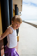 Image showing Young girl on beachside walkway